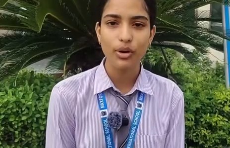 A senior student speaking at the Flag Day programme